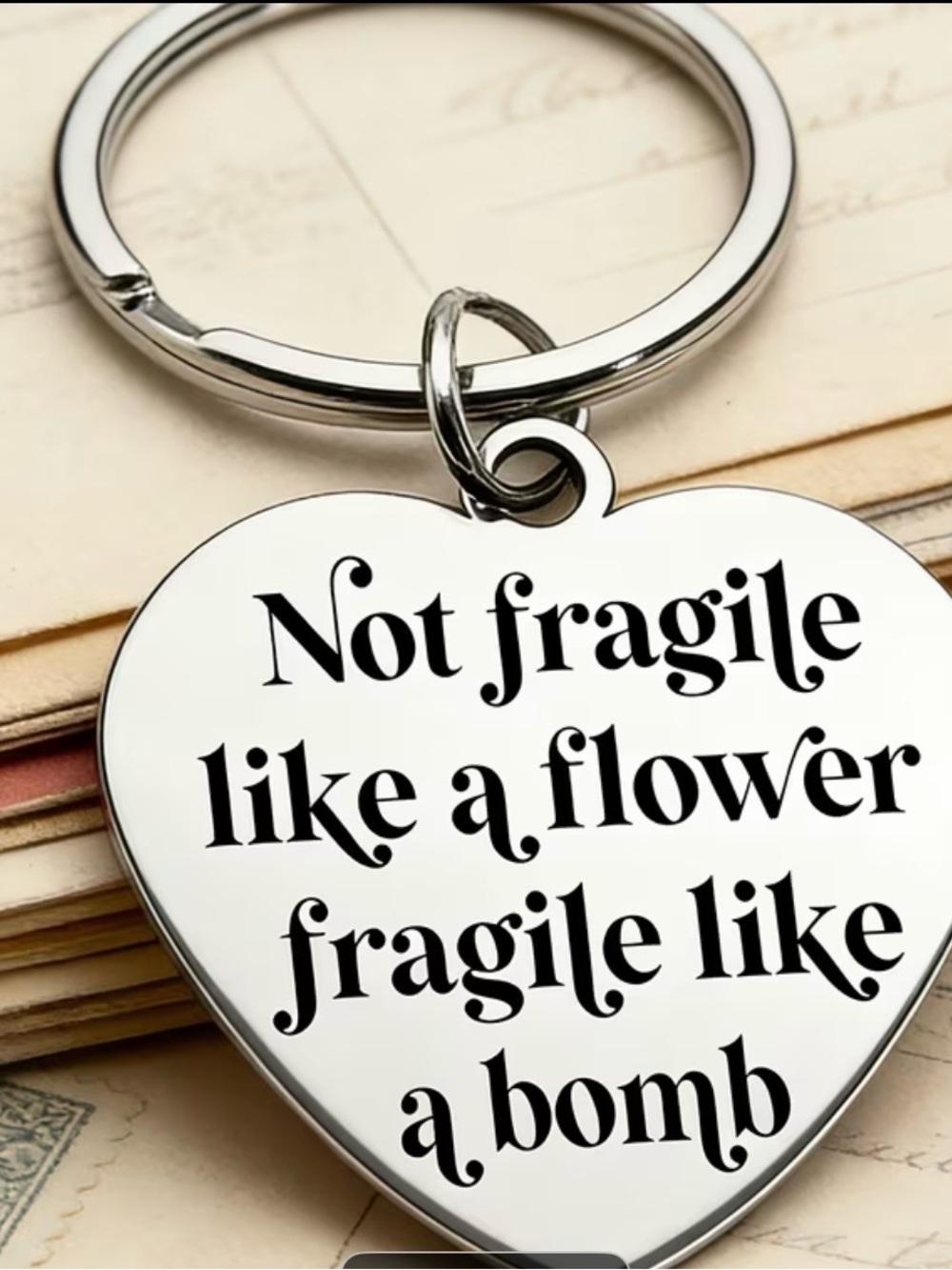 Not Fragile Like a Flower, Fragile Like a Bomb Silver Heart Keychain